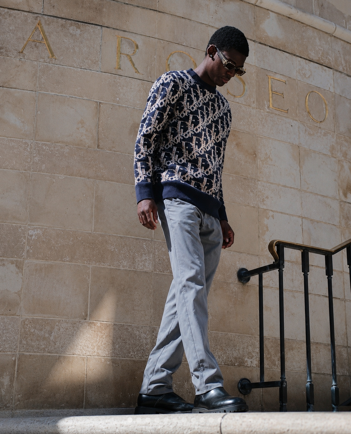 Monogram knit on stone steps