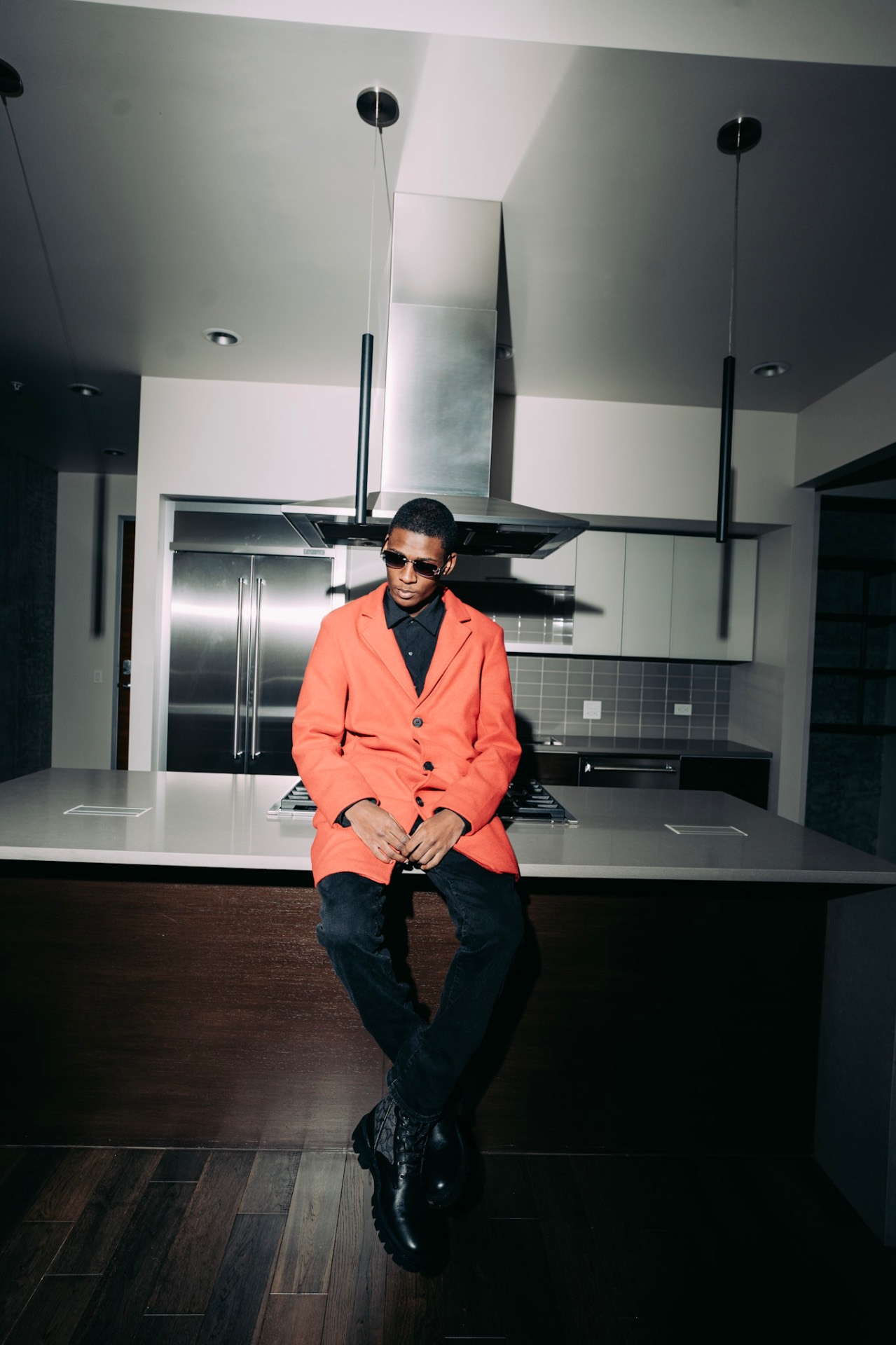 Jordan Hall in orange blazer