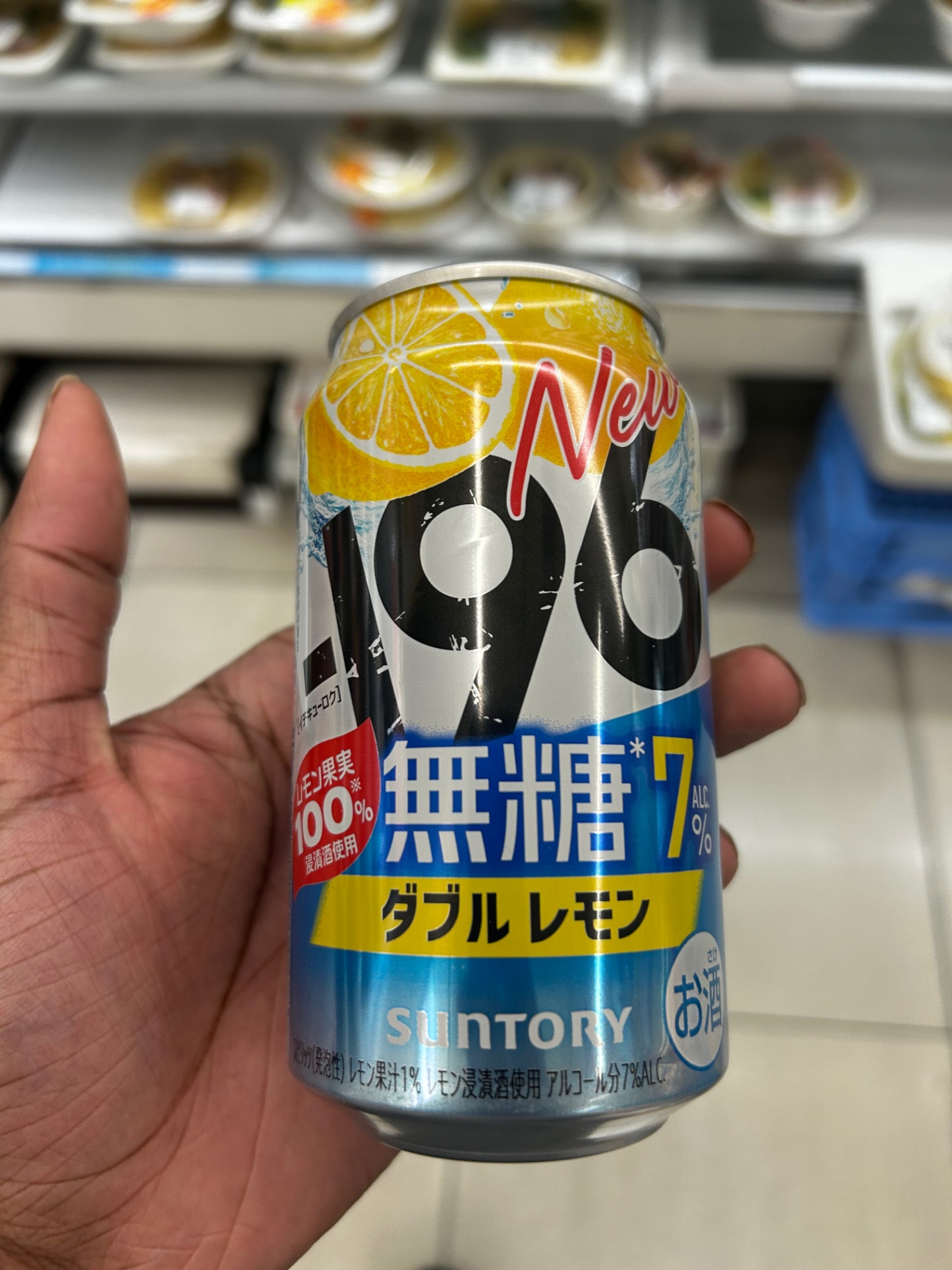 Suntory -196 lemon chuhai can held at a konbini